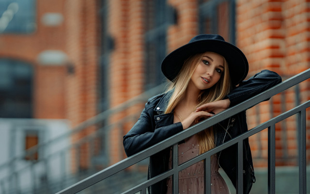 Woman blackhat jacket brickwall portrait free wallpaper for desktop - medium preview image