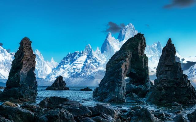 Beach rocks mountains sky water free wallpaper for desktop - medium preview image