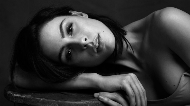 Woman laying table head hand free wallpaper for desktop - medium preview image