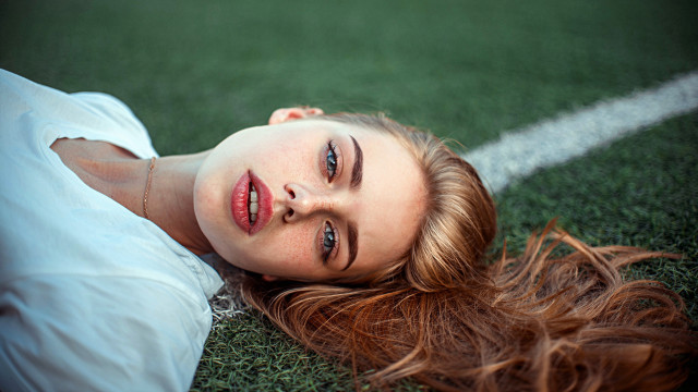Woman lying grass blue eyes free wallpaper for desktop - medium preview image