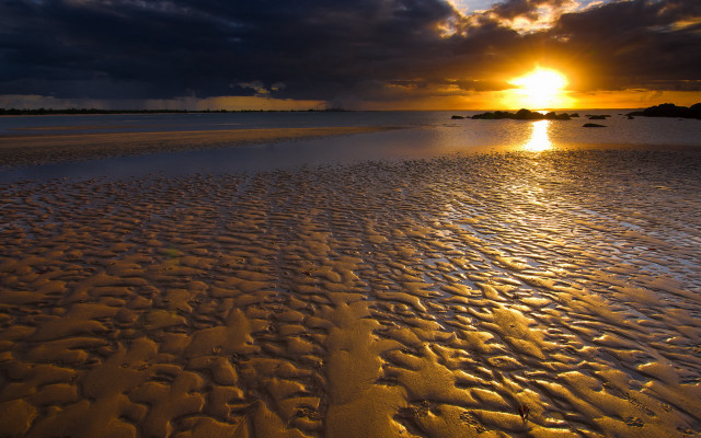 Sunset beach footprints clouds water free wallpaper for desktop - medium preview image