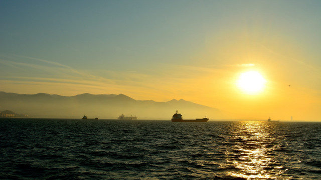 Sunset boat mountain ocean lake free wallpaper for desktop - medium preview image