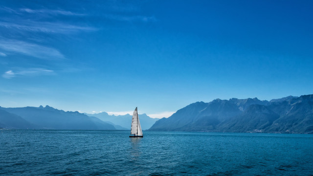 Sailboat mountains blue sky clouds free wallpaper for desktop - medium preview image