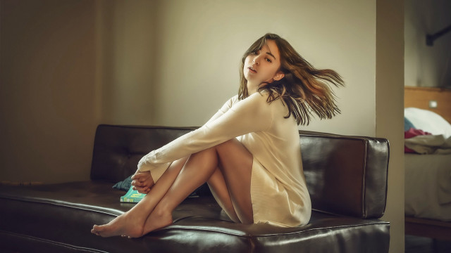 Woman sitting couch blowing wind free wallpaper for desktop - medium preview image