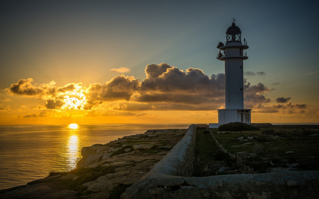 Lighthouse rocky cliff sunset clouds #2 free wallpaper for desktop - medium preview image