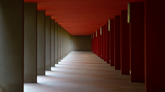 Red hallway symmetric doors columns free wallpaper for desktop - medium preview image