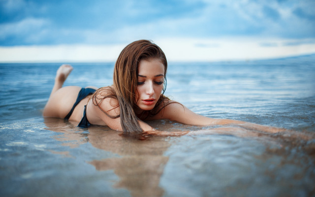 Woman water bikini jeans laying free wallpaper for desktop - medium preview image