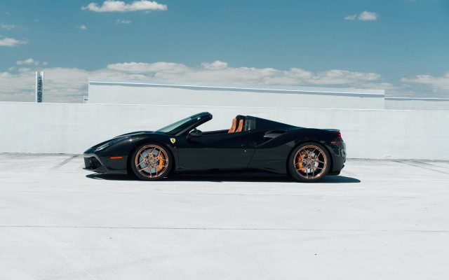 Black sports car sunlit roof free wallpaper for desktop - medium preview image