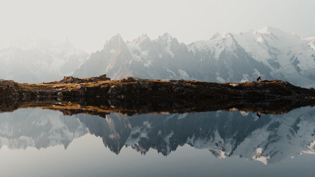 Mountain lake person outcropping nature free wallpaper for desktop - medium preview image