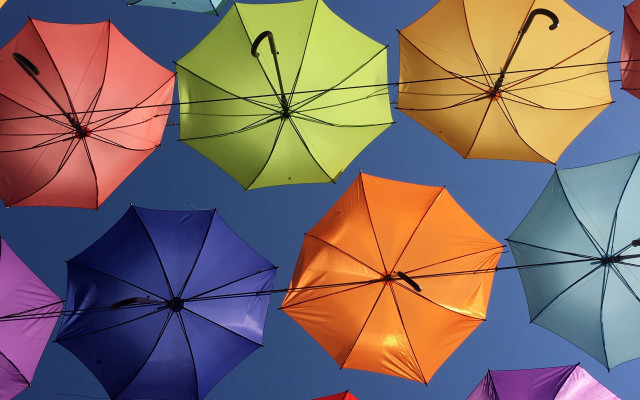 Multicolored umbrellas hanging row sunny free wallpaper for desktop - medium preview image