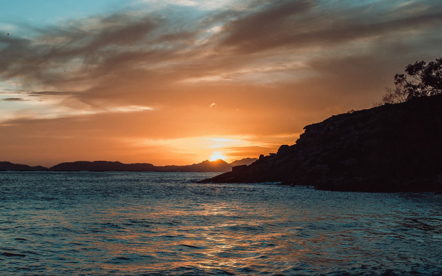 Sunset water island clouds cityscape free wallpaper for desktop - medium preview image