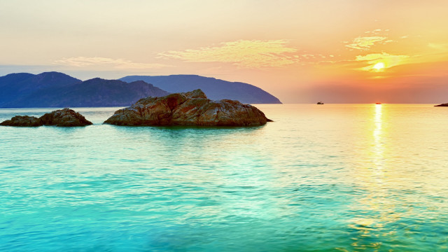 Sunset water mountains boat sky free wallpaper for desktop - medium preview image