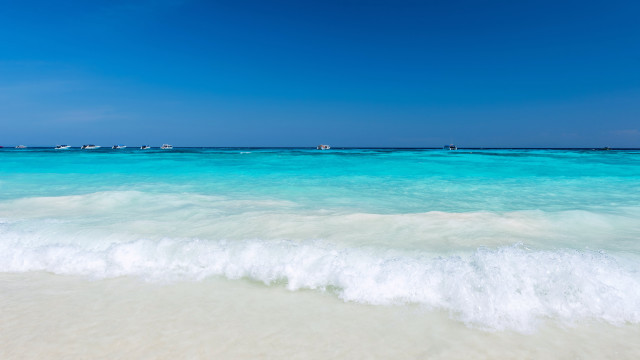 Beach waves boats sky lighthouse free wallpaper for desktop - medium preview image