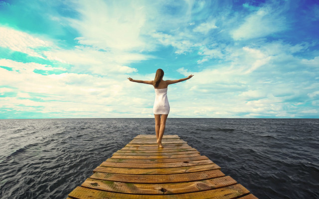 Woman pier outstretched sea sky free wallpaper for desktop - medium preview image