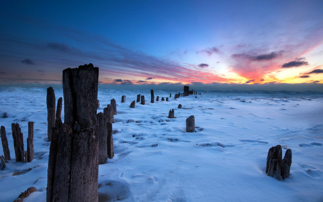 Sunset snowy field fence poles free wallpaper for desktop - medium preview image