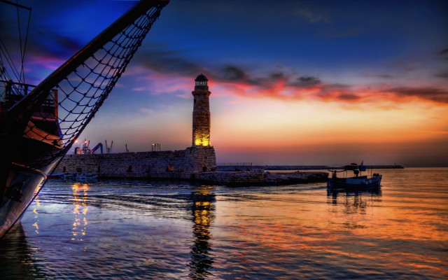 Lighthouse sunset mystical boat water free wallpaper for desktop - medium preview image