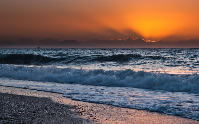 Sunset ocean waves boat mountains free wallpaper for desktop - medium preview image