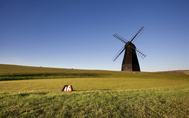 Windmill field person tiltshift sunset free wallpaper for desktop - medium preview image
