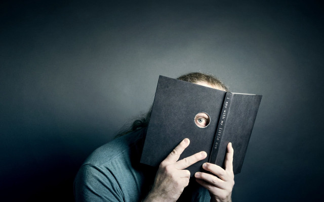 Man hiding face book hole free wallpaper for desktop - medium preview image