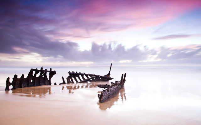 Beach wooden structures cloudy sky free wallpaper for desktop - medium preview image