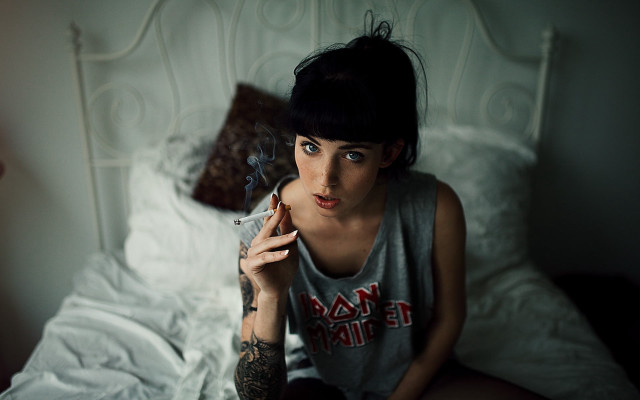 Woman smoking bed white comforter free wallpaper for desktop - medium preview image