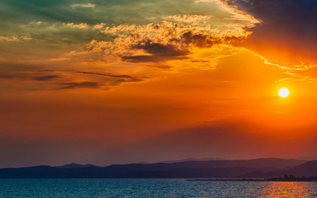 Sunset water mountains boat clouds free wallpaper for desktop - medium preview image