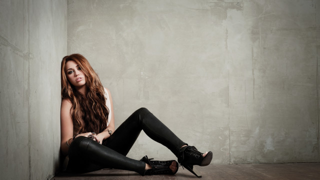 Woman sitting black leather pants free wallpaper for desktop - medium preview image