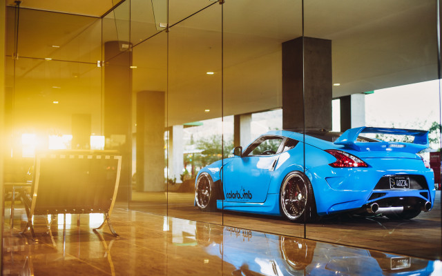 Blue sports car glass wall free wallpaper for desktop - medium preview image