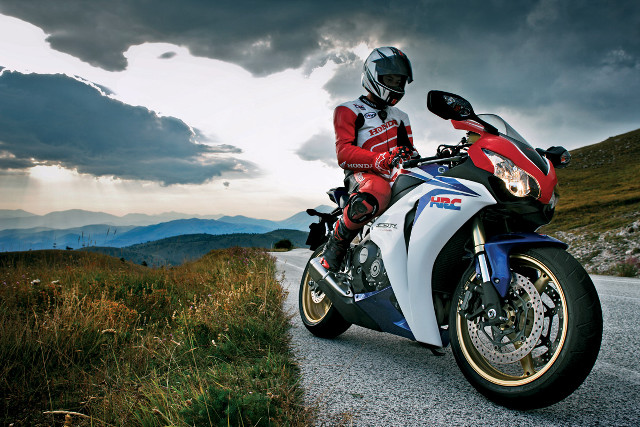 Motorcycle person road cloudy sky free wallpaper for desktop - medium preview image