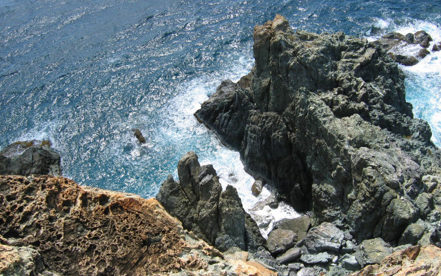 Rocky cliff water swimming zenith free wallpaper for desktop - medium preview image