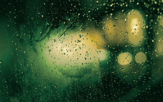 Rainy window streetlight building fireworks free wallpaper for desktop - medium preview image