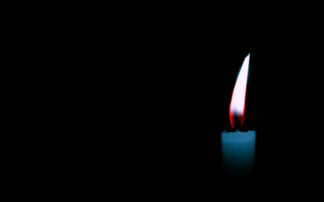 Lit candle red flame black free wallpaper for desktop - medium preview image
