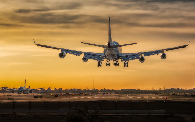 Large jetliner cloudy sunset runway free wallpaper for desktop - medium preview image