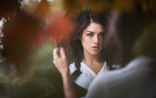 Woman umbrella serious portrait blurry free wallpaper for desktop - medium preview image