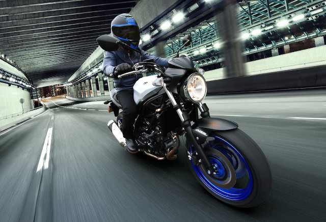 Man riding motorcycle night street free wallpaper for desktop - medium preview image