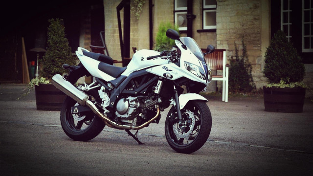 White motorcycle parked street building free wallpaper for desktop - medium preview image