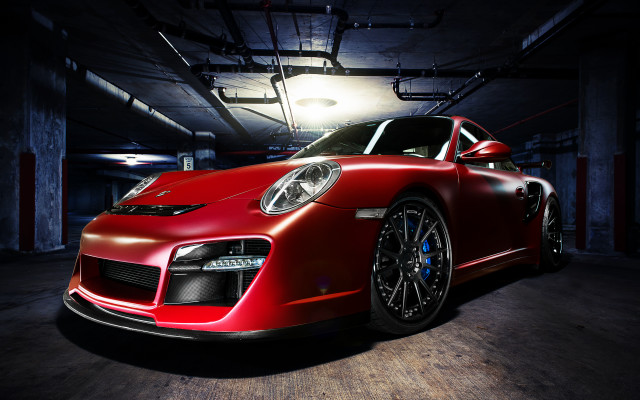 Red sports car garage spotlight free wallpaper for desktop - medium preview image