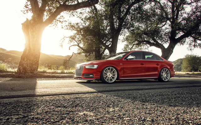 Red car parked trees hill free wallpaper for desktop - medium preview image