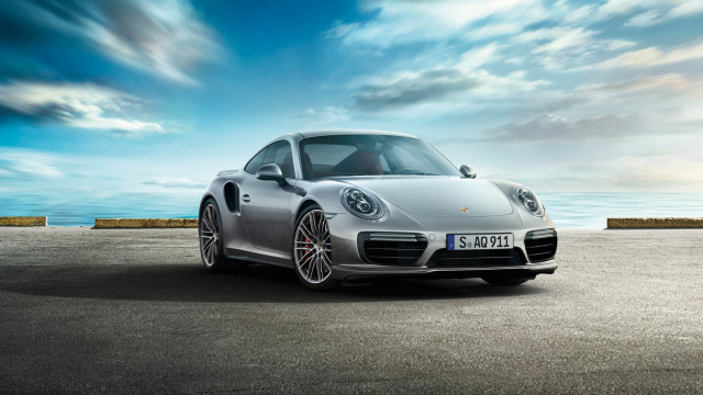 Silver porsche ocean cloudy sky free wallpaper for desktop - medium preview image