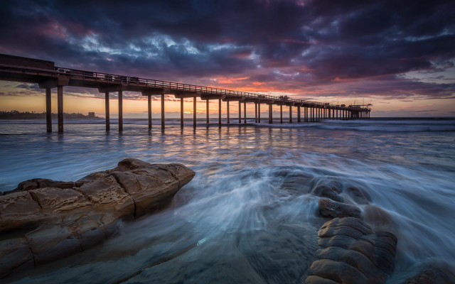 Pier sunset ocean waves rock free wallpaper for desktop - medium preview image