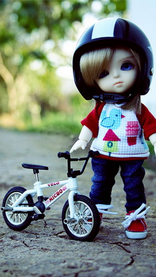 Doll riding bike helmet red free wallpaper for mobile - medium preview image
