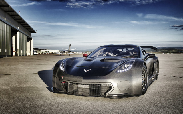 Silver sports car hangar plane free wallpaper for desktop - medium preview image