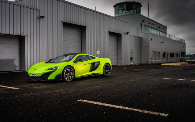 Green sports car hangar cloudy free wallpaper for desktop - medium preview image
