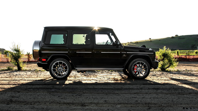 Black suv dirt lot forest free wallpaper for desktop - medium preview image