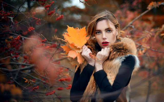 Woman holding leaf autumn fire free wallpaper for desktop - medium preview image