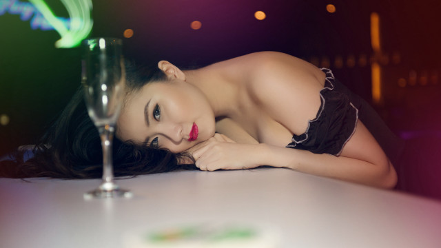 Woman black dress leaning table free wallpaper for desktop - medium preview image