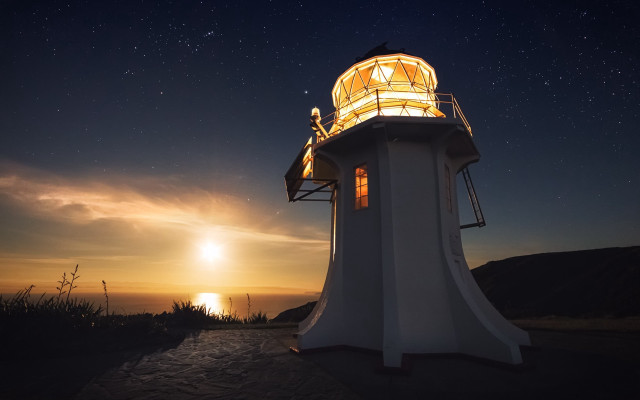 Lighthouse night sunset person astronaut free wallpaper for desktop - medium preview image