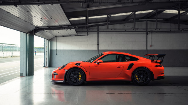 Bright orange porsche garage jigsaw free wallpaper for desktop - medium preview image