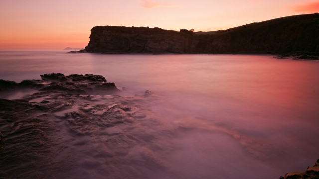 Rocky cliff water sunset pink #2 free wallpaper for desktop - medium preview image