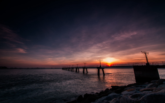 Sunset water pier clouds cityscape free wallpaper for desktop - medium preview image